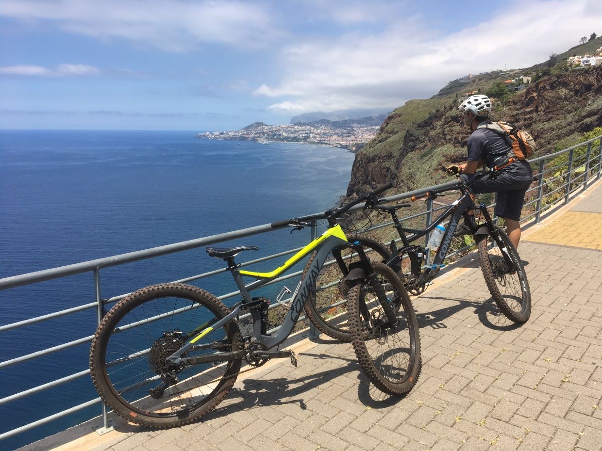 Biker enjoying the view over the coast